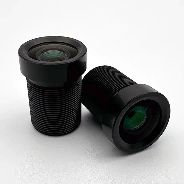 Two Commonlands 8mm M12 board lenses, one upright showing the coated front element and one on its side showing the M12x0.5 threaded barrel.