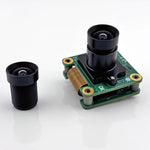 CIL054 5.5mm M12 lens mounted on a camera board, with a second lens beside it