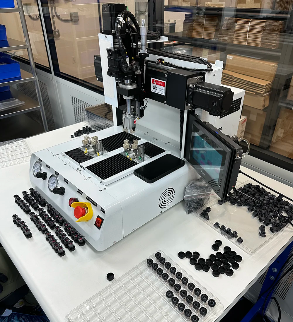 Semi-automated M12 lens to lens mount assembly machine in the Commonlands San Diego cleanroom