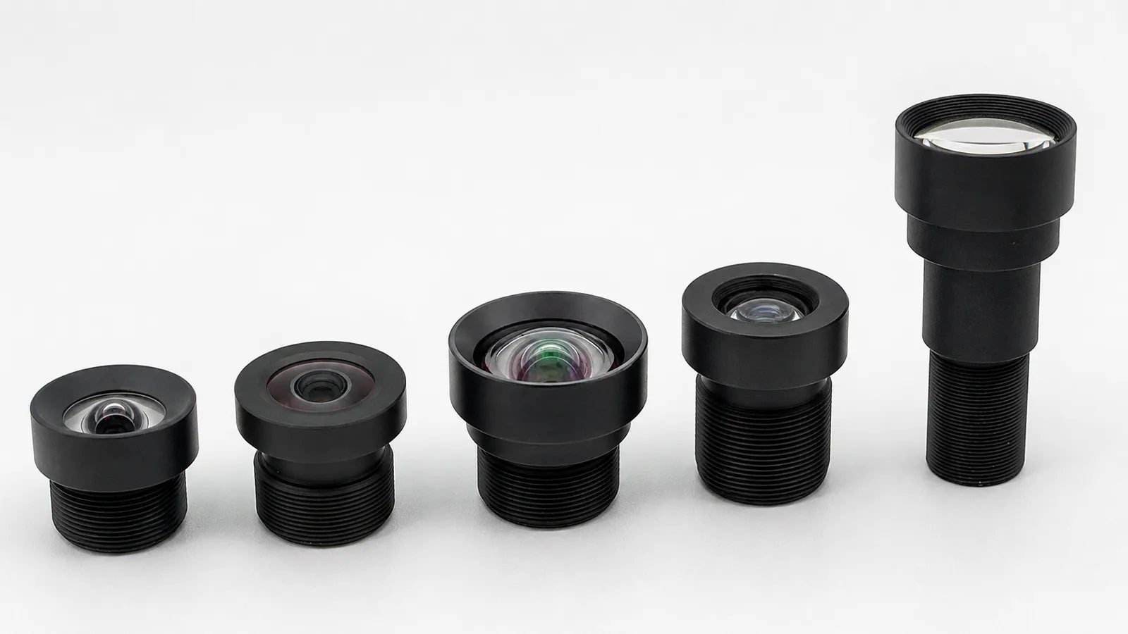 Five Commonlands M12 lenses arranged from short wide-angle to long telephoto by focal length