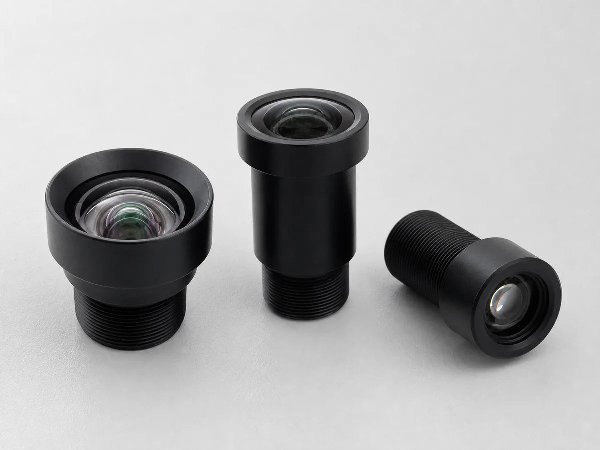 A disassembled machine vision lens showing its row of small coated glass elements