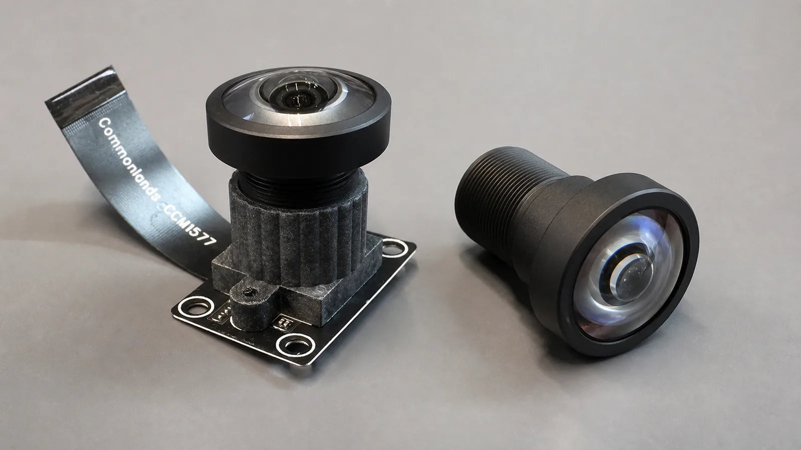 A Commonlands M12 lens held above a bare CMOS sensor to show chief ray angle geometry