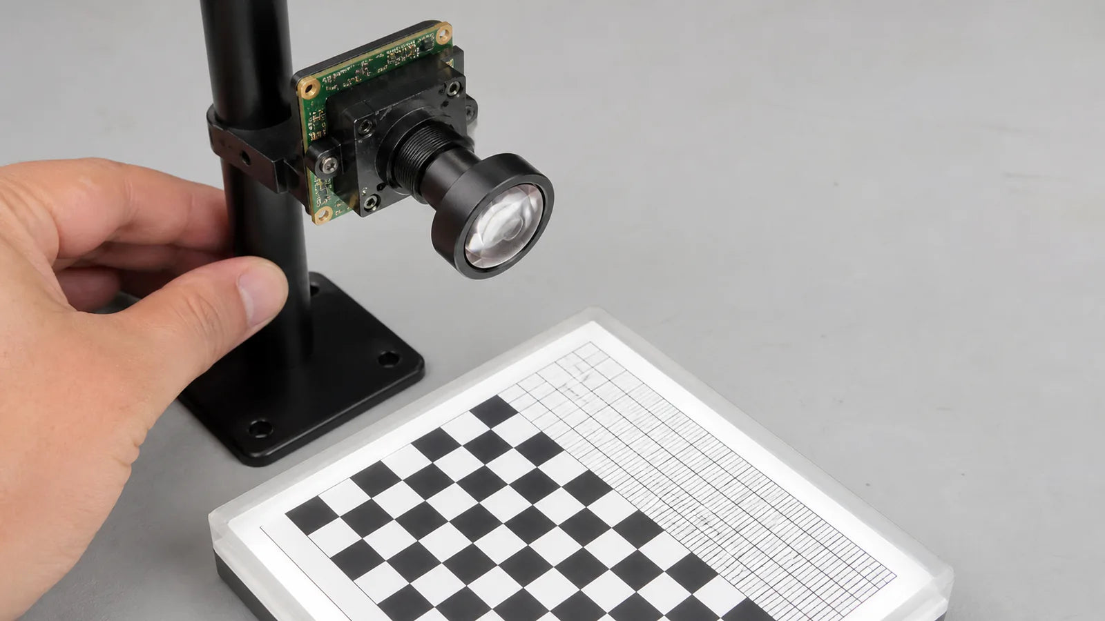 Commonlands low distortion M12 lens imaging a checkerboard grid with lines straight to the edges