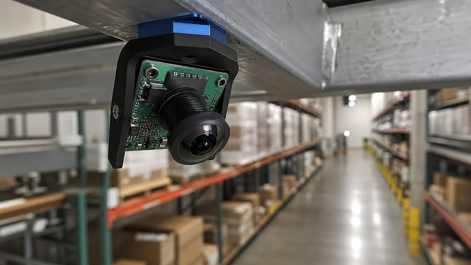 Commonlands fisheye M12 lens with a domed front element mounted on a warehouse camera